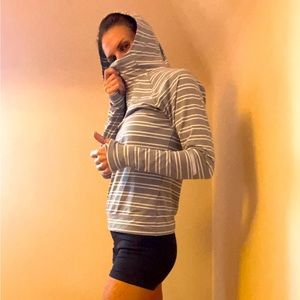 New Balance Running Shirt with hood. Soft and comfortable fast drying material.